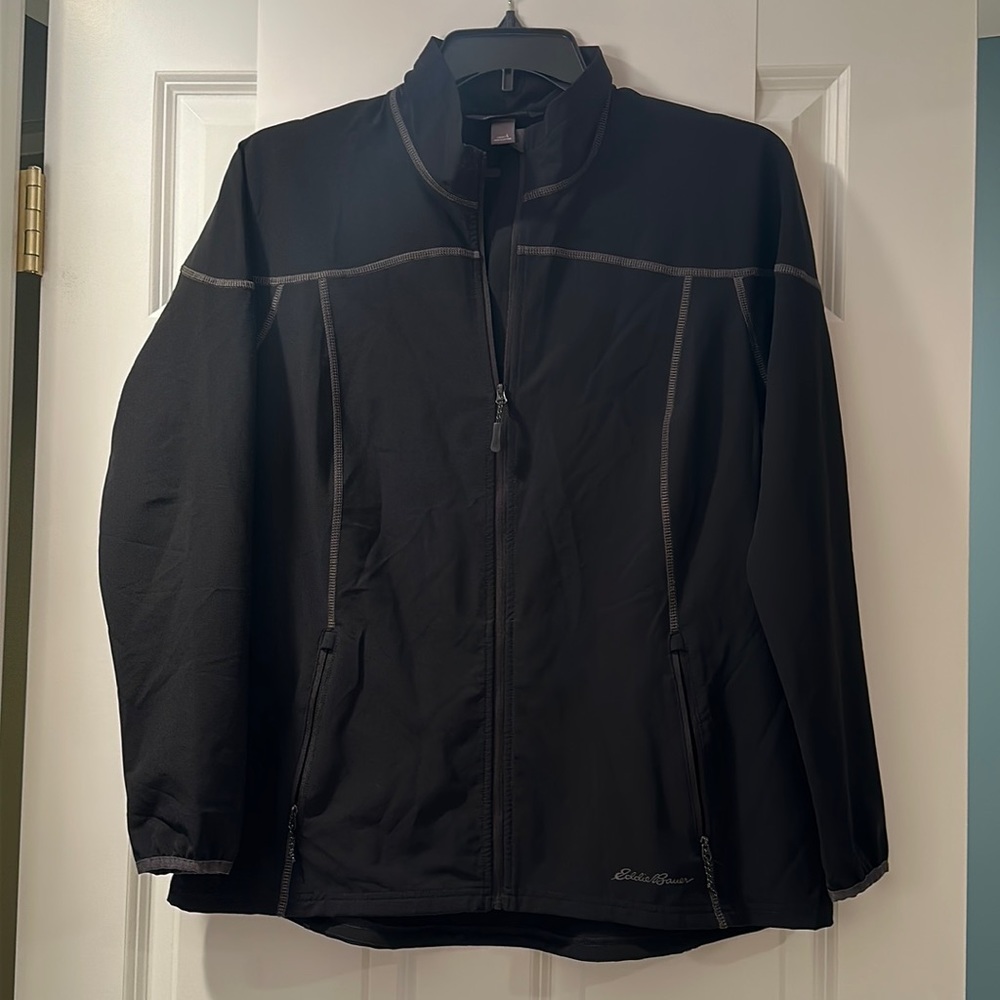 Women’s L Eddie Bauer jacket. Black, lightweight, w a zipper + zippered pockets.